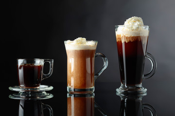 Various coffee drinks on a black background.