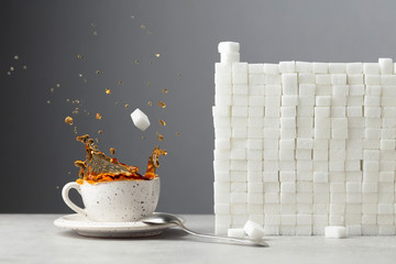  Tea splash with sugar cubes.