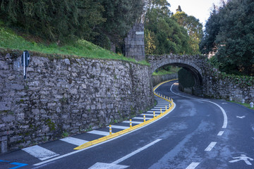 Fototapeta na wymiar Italy, Bellagio, Lake Como, ROAD PASSING THROUGH ARCH BRIDGE