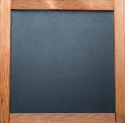 Fototapeta premium Blackboard with wooden frame. Close-up.