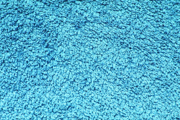 Blue texture shaggy towel background. Structure of a blue cotton towel.