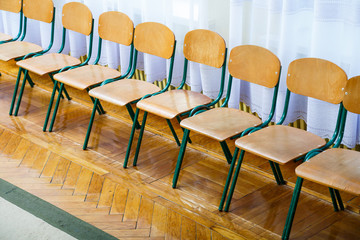 Fototapeta na wymiar Wooden chairs in one row