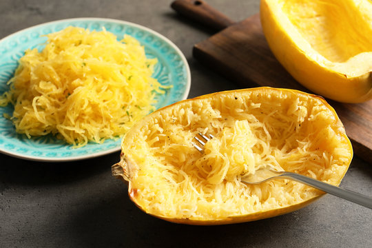 Cooked spaghetti squash and fork on table