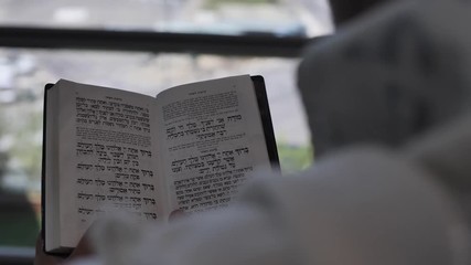 Hebrew text Modhe Ani morning prayer. Pray letters from Jewish Torah Bible Old Testament Ancient Text. Spiritual religious text kabbalah close up shot