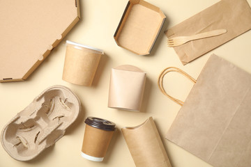 Different containers for mock up design on beige background, flat lay. Food delivery service