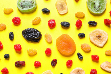 Flat lay composition with different dried fruits on color background. Healthy lifestyle