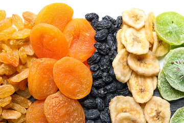 Different dried fruits on white background, top view. Healthy lifestyle