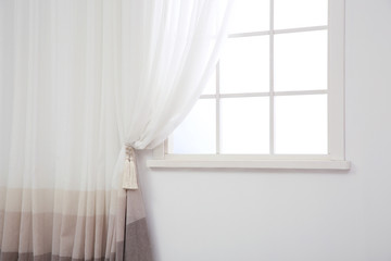 Modern window with curtain in room, space for text. Home interior