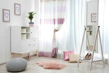 Modern furniture and window curtains in stylish room interior
