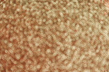 Gold glitter with bokeh effect as background, closeup