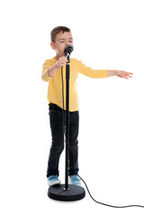 Cute funny boy with microphone on white background