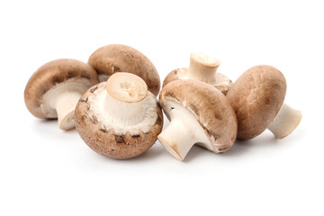 Fresh raw champignon mushrooms on white background