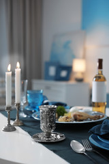 Table served for Passover (Pesach) Seder indoors, space for text