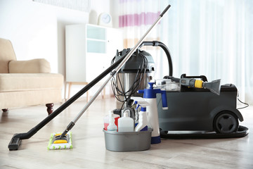 Professional cleaning supplies and equipment on floor indoors