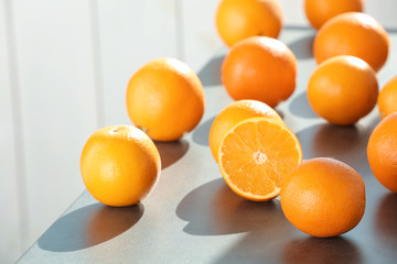 Fresh juicy oranges on table, space for text. Healthy fruits