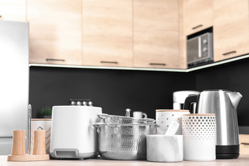 Fototapeta na wymiar Set with modern domestic appliances in kitchen