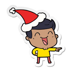 sticker cartoon of a man laughing wearing santa hat