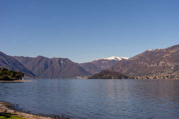 Italy, Bellagio, Lake Como, a large body of water with a mountain in the background