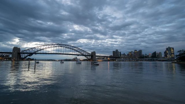 SYDNEY, AUSTRALIA - SEPTEMBER 16, 2016: 4K Cinematic Time Lapse Footage for Sydney city skyline at sunrise, taken from Blues Point Reserve north of Sydney.