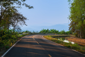 Curve road beside irrigation canal