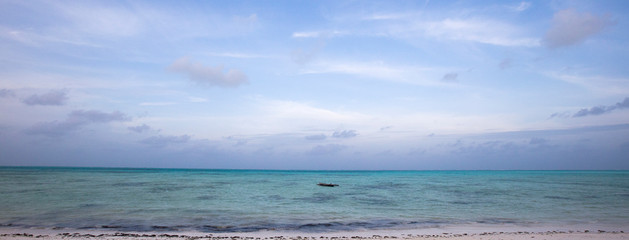 Boat of a fisherman on a tropical beach, Zanzibar, Tanzania
