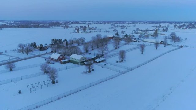 Aerial View of Early Morning Sunrise After a Snow Fall in Amish Countryside as Senn by s Drone