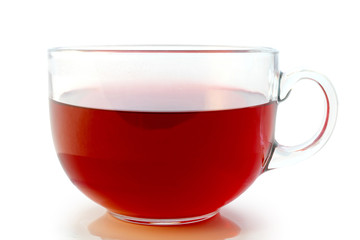 Glass cup of hot aromatic red tea