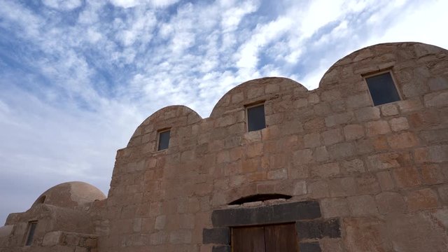 Pan Shot of UNESCO World Heritage Site Qasr Amra Desert Castle with Three Domes