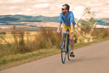 Fototapeta premium Gorgeous biker in the nature going somewhere with ethereal concept