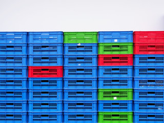 Close up to plastic baskets colorful baskets wall background.