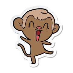 sticker of a cartoon laughing monkey