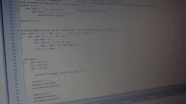Coding a small program on a notebook in the office.
