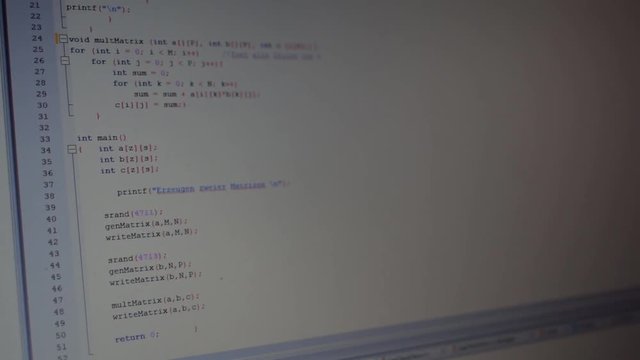 Coding a small program on a notebook in the office.