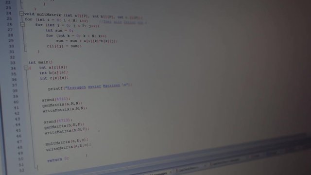 Coding a small program on a notebook in the office.
