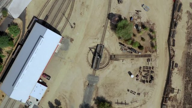 Drone footage of a old train turnstile from straight above