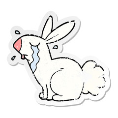 distressed sticker of a cartoon bunny rabbit crying