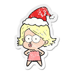 distressed sticker cartoon of a girl pouting wearing santa hat