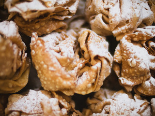 Famous cake snowball or Schneeball from Rothenburg ob der Tauber, Franconia, Bavaria, Germany - fried dough made of short crust pastry strips in round shape and dusted with confectioner's sugar