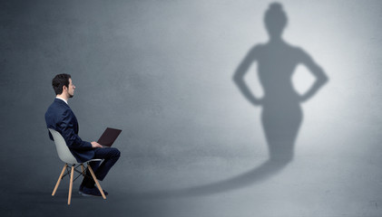 Rich businessman staying and offering stuffs to a pretty shadow woman
