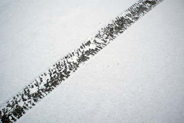 Car tyre tracks in snow