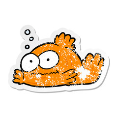 distressed sticker of a cartoon goldfish