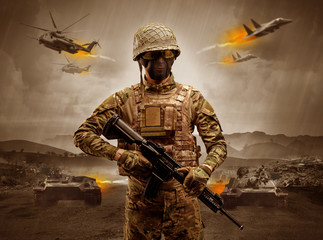Armed soldier with sniper in the middle of a war
