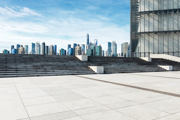 Fototapeta premium Empty square floor and panoramic city skyline with buildings in Shanghai
