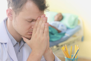 Doctors are stressed with a patient lying in the elderly patient.