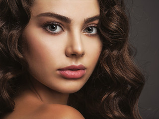 Fototapeta premium Closeup face of a beautiful woman with a smoky eye makeup