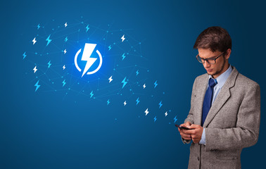 Young person using phone with power concept
