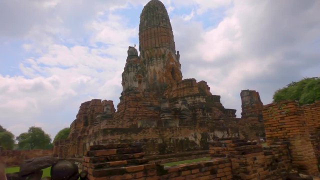 A female backpacker exploring the ancient Wat Phra Ram temple on her gap year to Thailand.