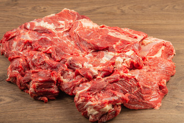 Raw fresh beef on a wooden background, catalog.