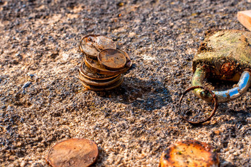 Rusty coins got out of the water.