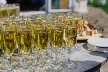 Glasses of champagne on the buffet table for guests.